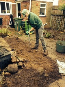 Cathy preparing the flowerbeds for planting